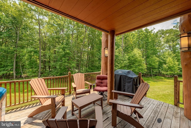 wooden deck with a lawn