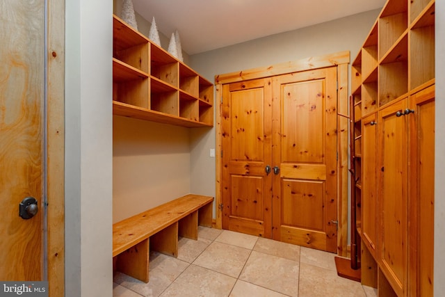 mudroom with light tile patterned flooring