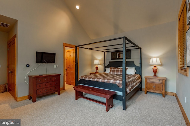 bedroom with carpet flooring, baseboards, visible vents, and high vaulted ceiling