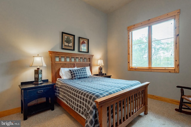 bedroom with baseboards and carpet floors