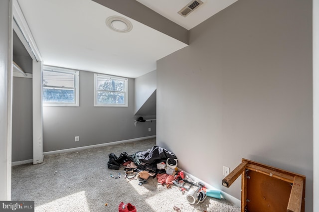 bonus room with carpet, visible vents, and baseboards