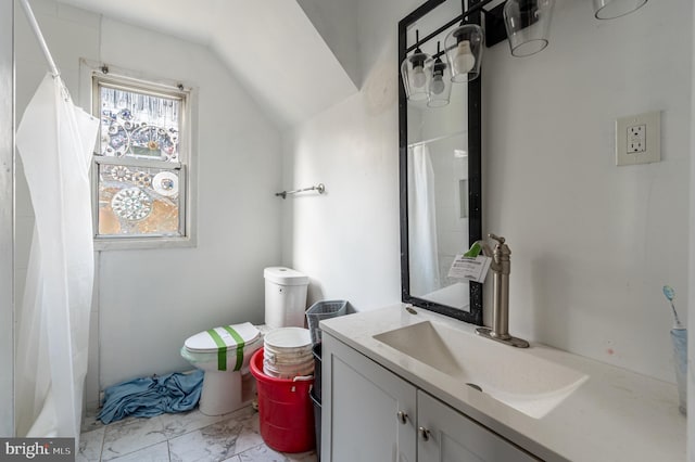 bathroom featuring lofted ceiling, toilet, a shower with shower curtain, vanity, and marble finish floor