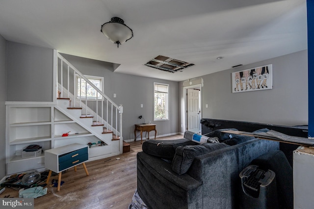 living room featuring stairway and wood finished floors