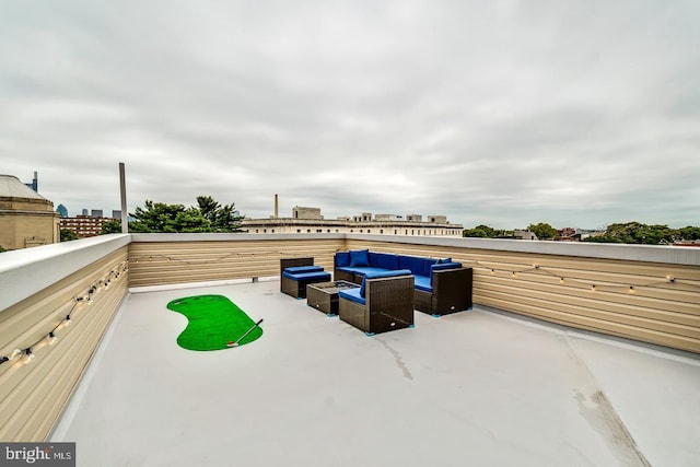 view of patio featuring a balcony and an outdoor living space