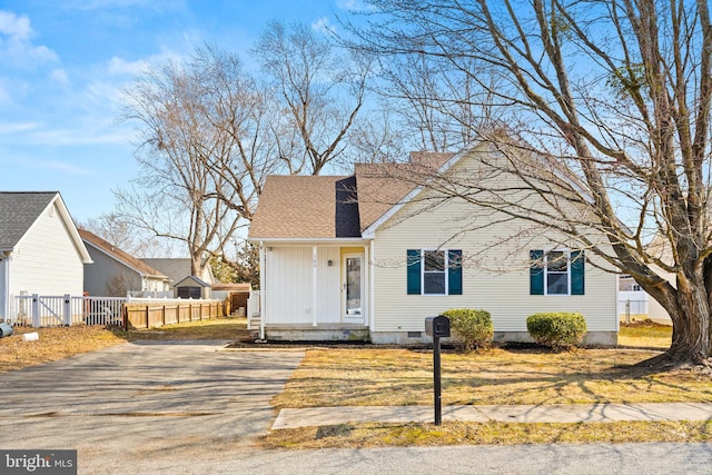 bungalow with crawl space, fence, and roof with shingles