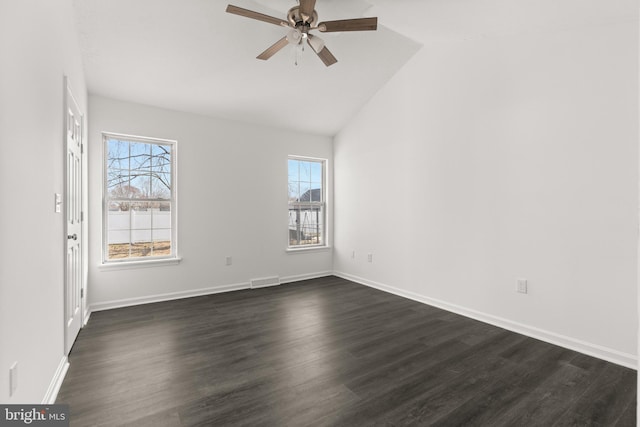 unfurnished room featuring vaulted ceiling, dark wood-style flooring, a wealth of natural light, and a ceiling fan