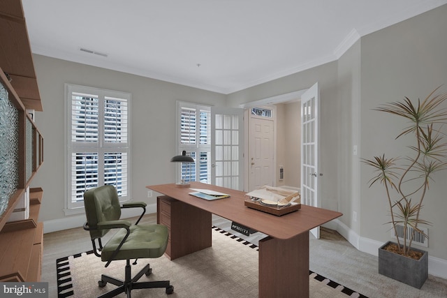 office space featuring baseboards, visible vents, and ornamental molding