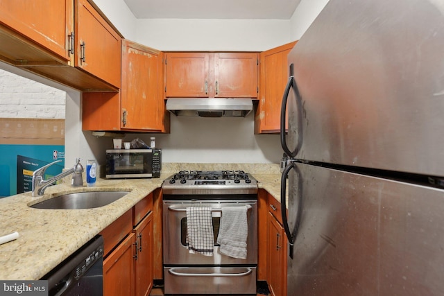 kitchen featuring extractor fan, stainless steel appliances, a sink, light stone countertops, and brown cabinetry