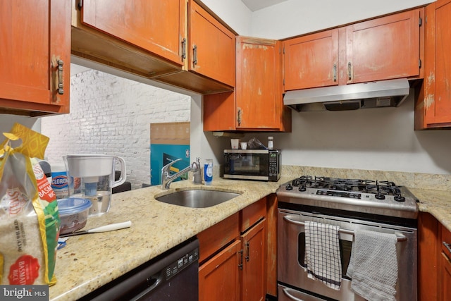 kitchen featuring under cabinet range hood, a sink, stainless steel range with gas cooktop, light stone countertops, and dishwasher