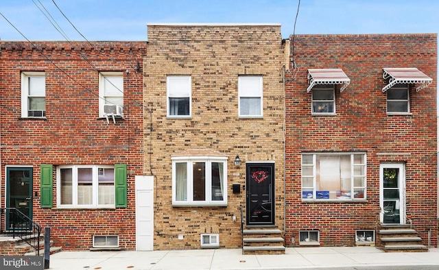 view of property featuring entry steps and cooling unit