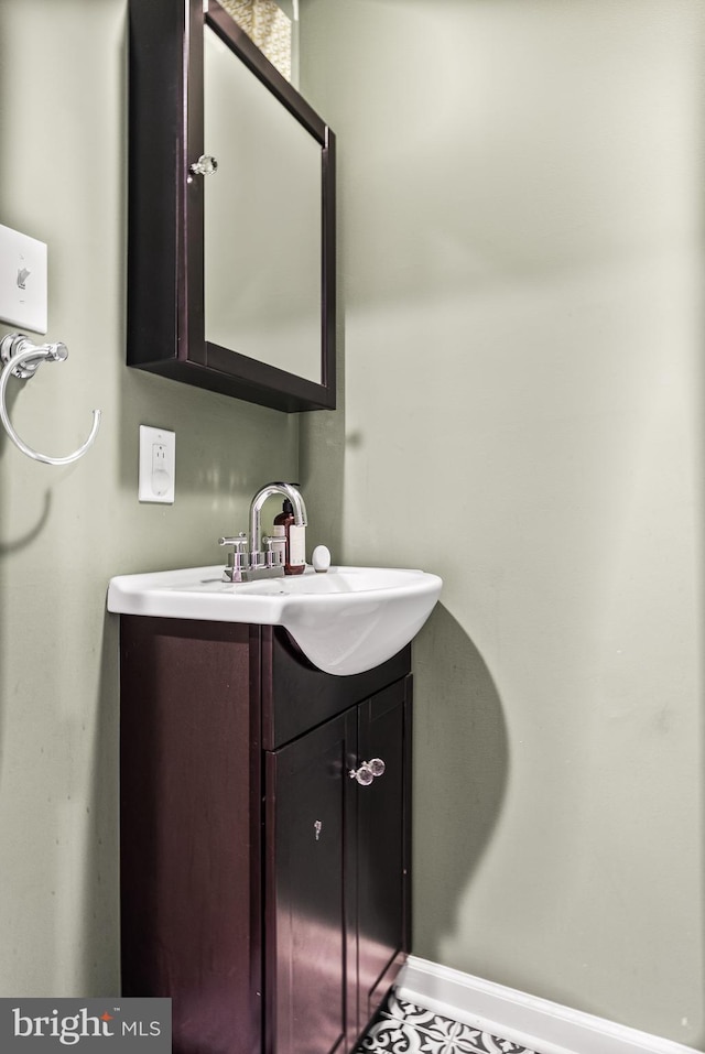 bathroom with vanity and baseboards