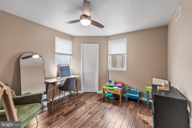 office area featuring visible vents, wood finished floors, baseboards, and ceiling fan