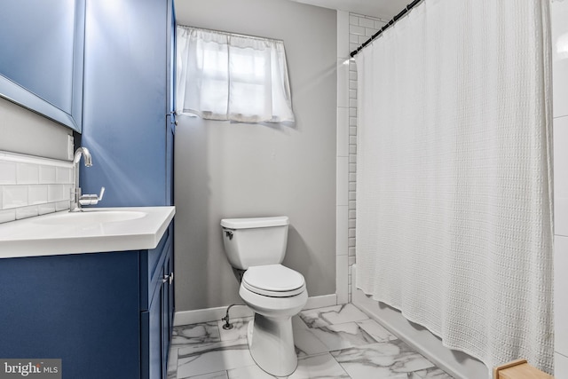 bathroom with baseboards, toilet, marble finish floor, and vanity