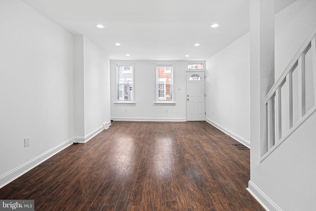 entryway featuring recessed lighting, visible vents, wood finished floors, baseboards, and stairs