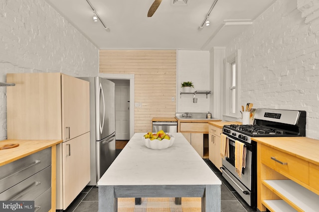 121 Kentucky Ave SE, Washington, DC 20003 - kitchen featuring stainless steel appliances, track lighting, and open shelves