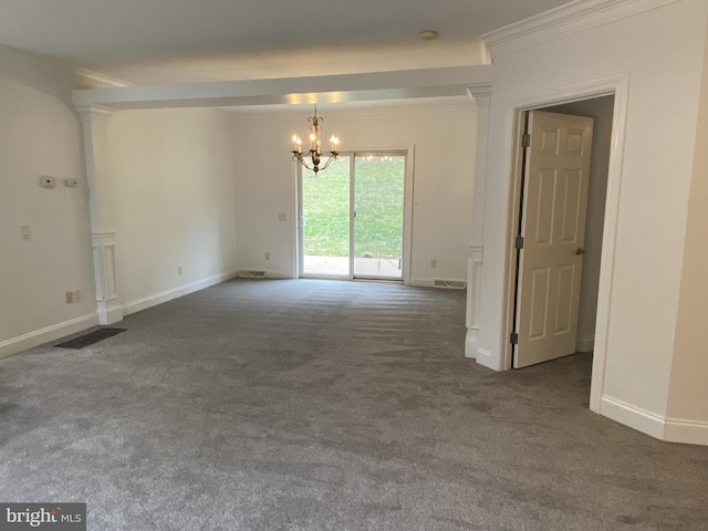 unfurnished room with baseboards, carpet, a chandelier, and crown molding