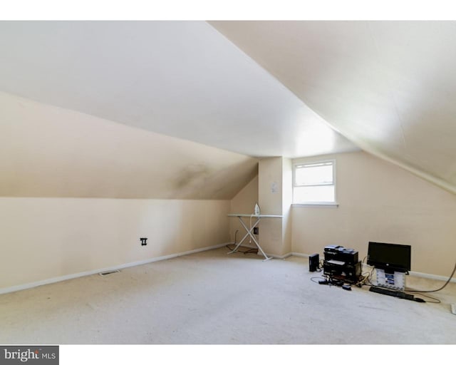 bonus room with carpet, vaulted ceiling, and baseboards