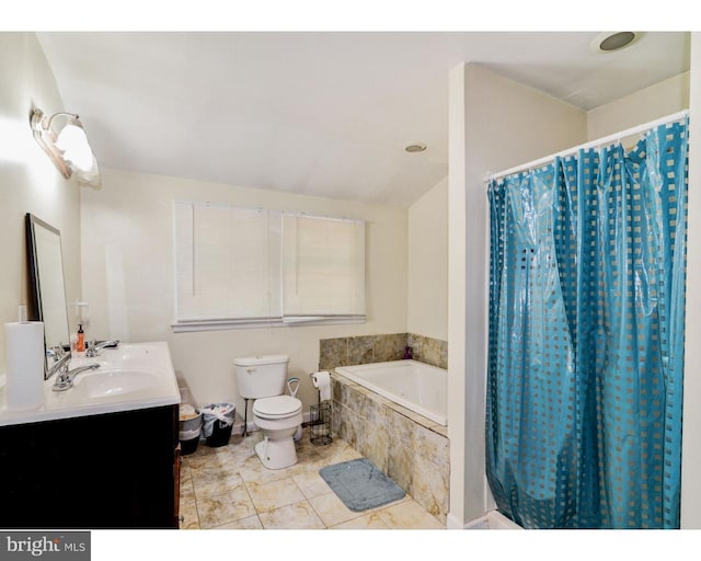 full bathroom with double vanity, toilet, tile patterned flooring, a sink, and tiled tub