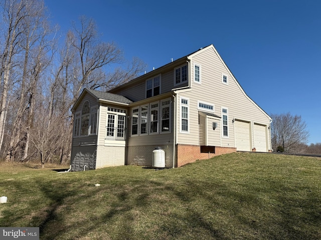 rear view of property with a sunroom and a lawn