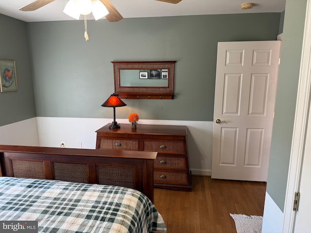 bedroom with ceiling fan and wood finished floors