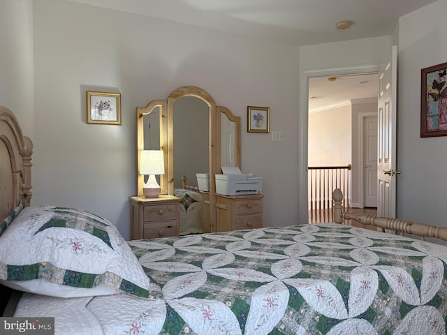 bedroom featuring crown molding