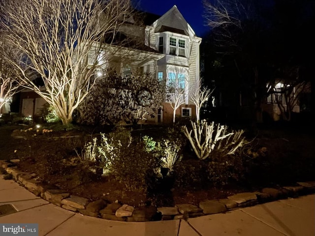 view of property exterior at night