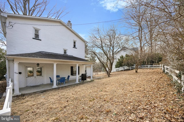 exterior space with a patio area and a fenced backyard