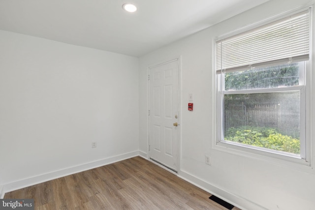 entrance foyer with baseboards, visible vents, wood finished floors, and recessed lighting