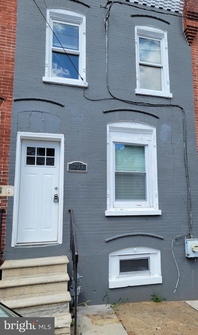 exterior space with brick siding