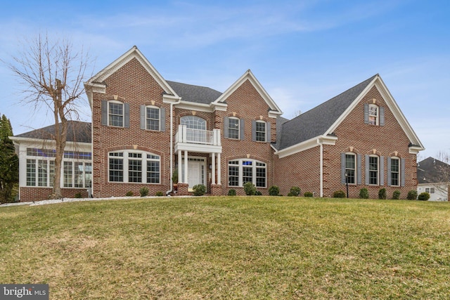 2205 Dhow Ct, Bowie, MD 20721 - colonial-style house with brick siding, a balcony, and a front lawn