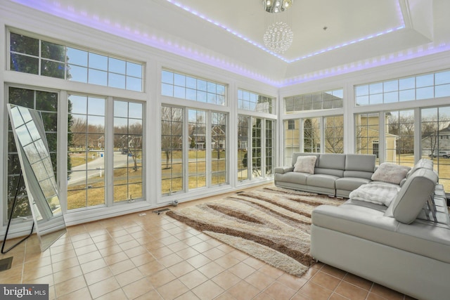 2205 Dhow Ct, Bowie, MD 20721 - sunroom / solarium with healthy amount of natural light, tile patterned flooring, a chandelier, a towering ceiling, and a tray ceiling