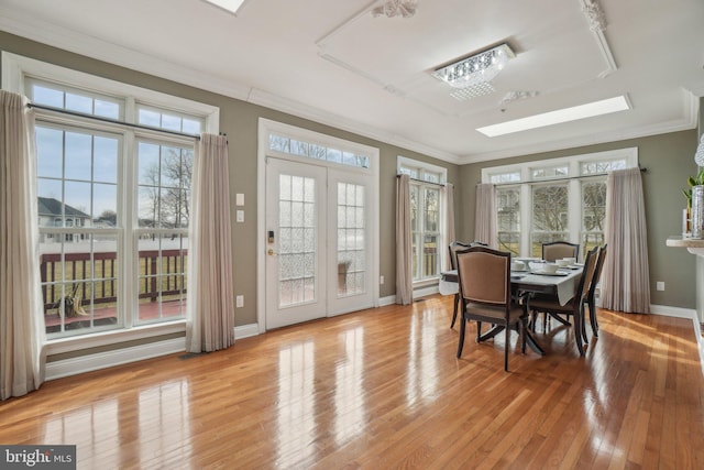 2205 Dhow Ct, Bowie, MD 20721 - dining area with ornamental molding, hardwood / wood-style floors, healthy amount of natural light, and a skylight