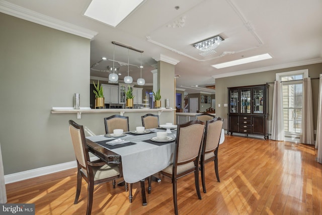 2205 Dhow Ct, Bowie, MD 20721 - dining area featuring crown molding, light wood-style floors, and a skylight