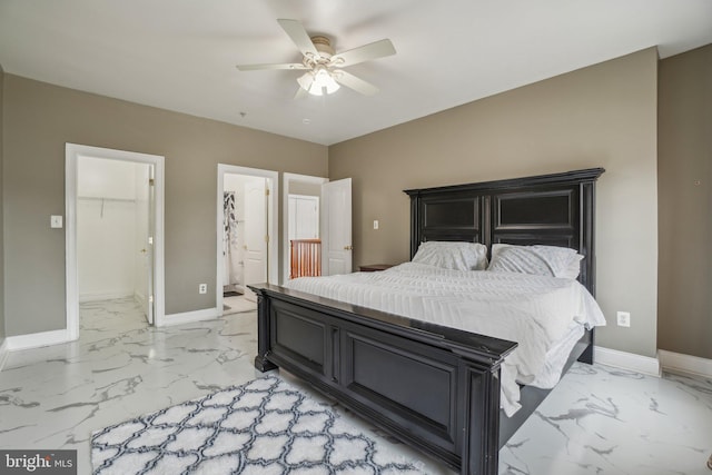 2205 Dhow Ct, Bowie, MD 20721 - bedroom featuring light marble finish flooring, a walk in closet, ensuite bathroom, and a ceiling fan