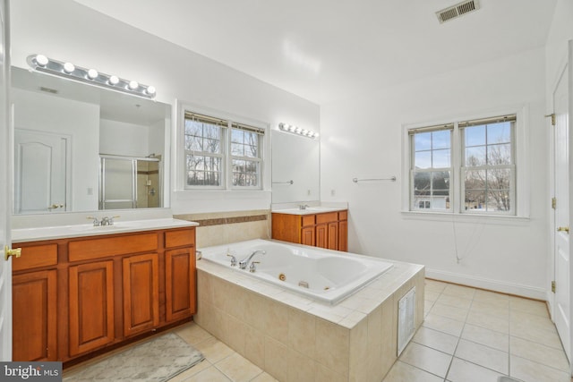 2205 Dhow Ct, Bowie, MD 20721 - bathroom with tile patterned floors, a stall shower, a whirlpool tub, and vanity