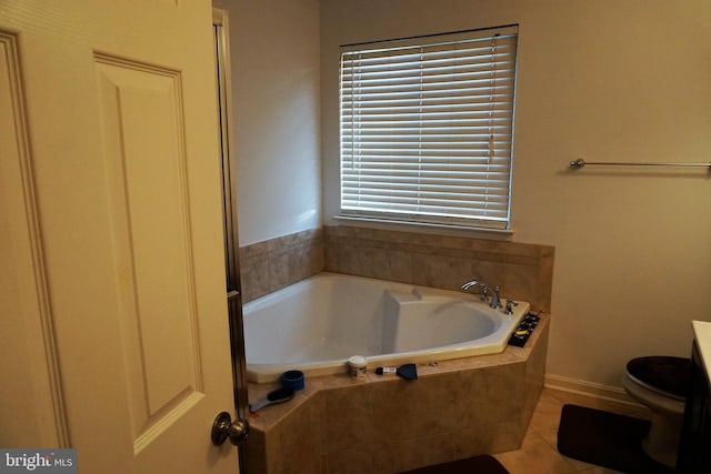 full bathroom with toilet, a garden tub, and tile patterned flooring