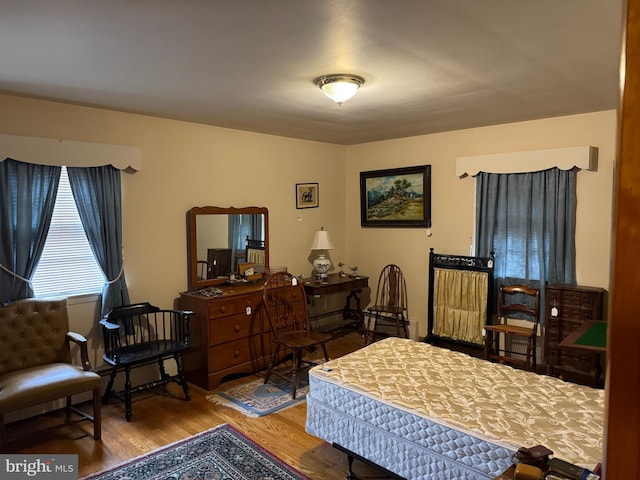 bedroom with wood finished floors