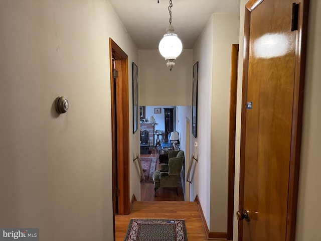 hallway with wood finished floors