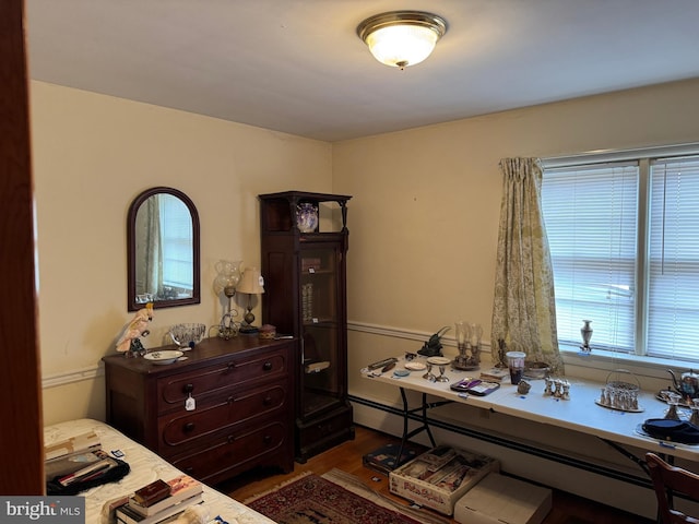 bedroom with wood finished floors