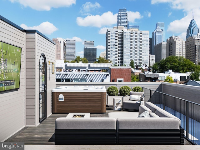 deck featuring an outdoor hangout area and a view of city