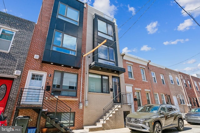 view of front facade featuring brick siding