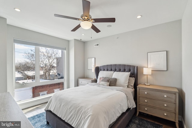 bedroom featuring dark wood-style floors, visible vents, recessed lighting, and a ceiling fan