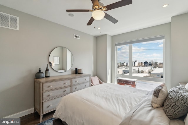 bedroom featuring recessed lighting, visible vents, baseboards, and dark wood-style flooring