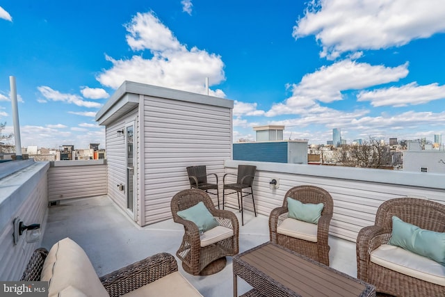 balcony featuring a city view and an outdoor hangout area