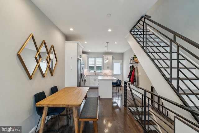 dining area with stairway, recessed lighting, and dark wood-style flooring