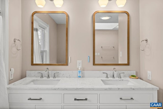 bathroom with double vanity and a sink