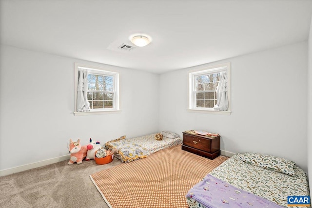 bedroom with baseboards, visible vents, and carpet flooring