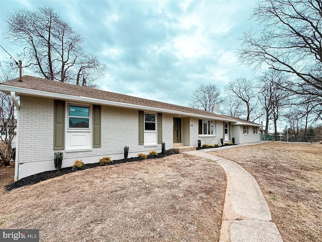 ranch-style house with brick siding