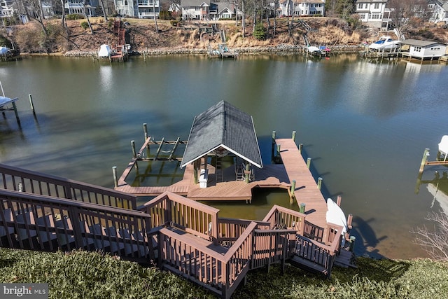 dock area with a water view and a residential view