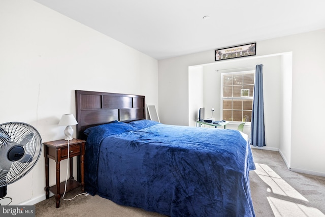 bedroom featuring baseboards and carpet flooring